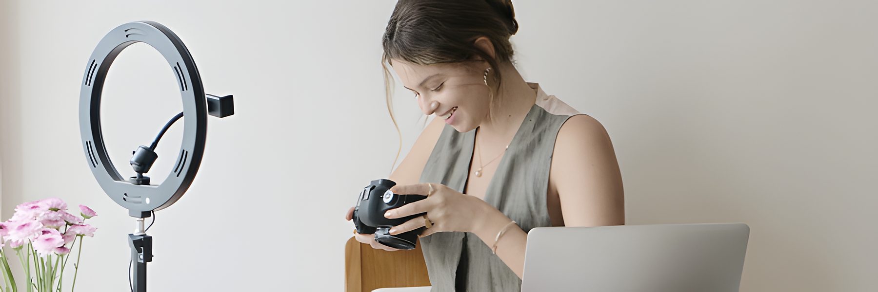 Creator setting up a camera and ring light to film UGC and influencer content
