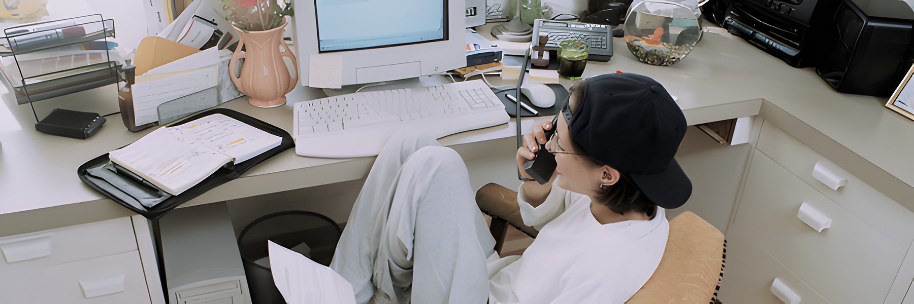 In-house marketer on the phone at an office desk