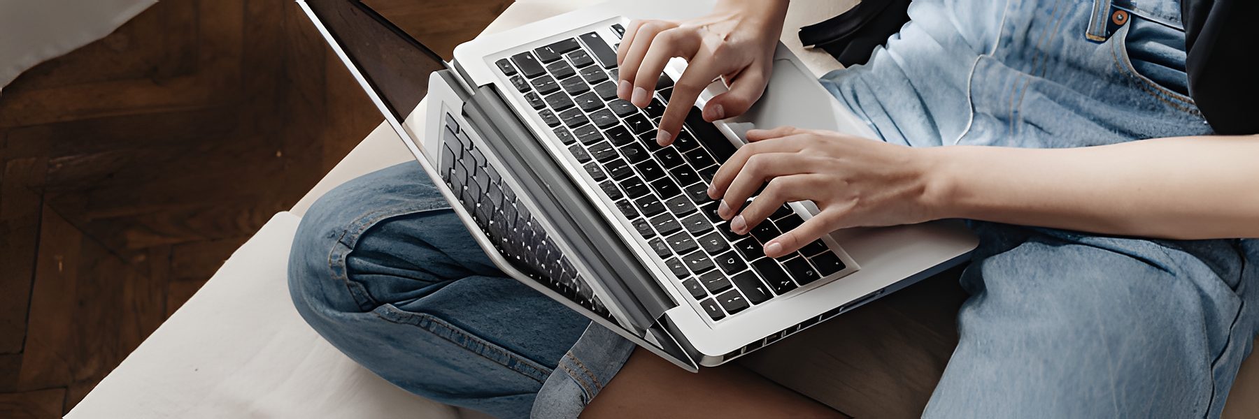 UGC agency team member typing on a laptop