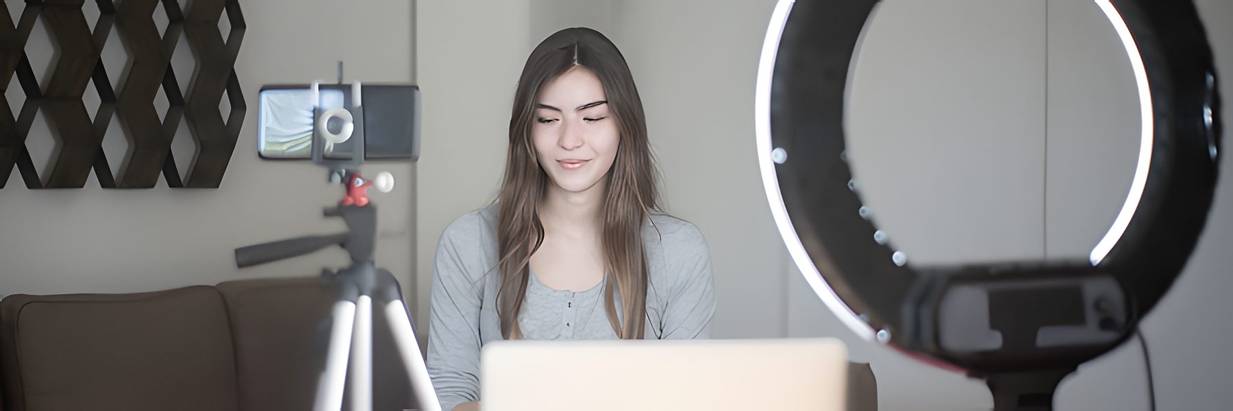 Creator filming UGC content with a ring light and a phone on a tripod
