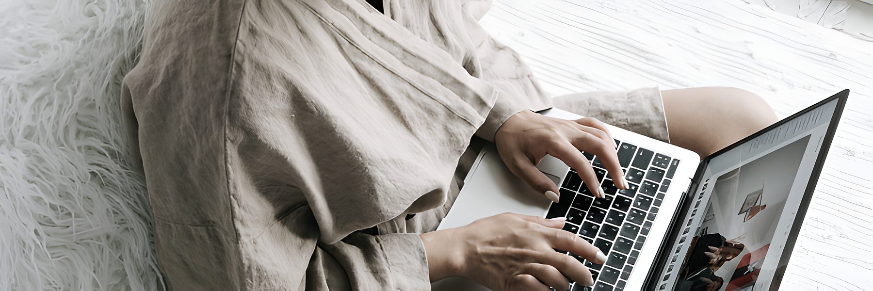 SaaS user working on a laptop at home